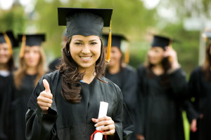 Graduate holding her diploma