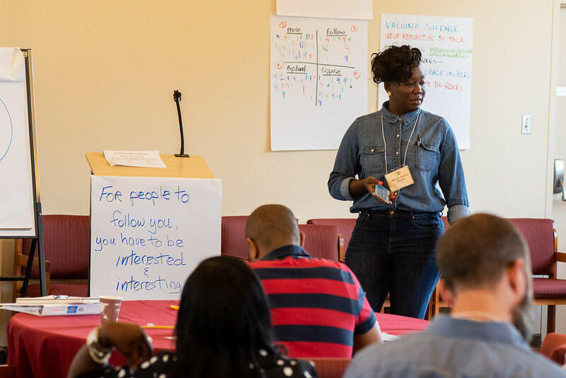 50141616003_00c6b758dc_c Woman standing at the front of a classroom teaching community organizers